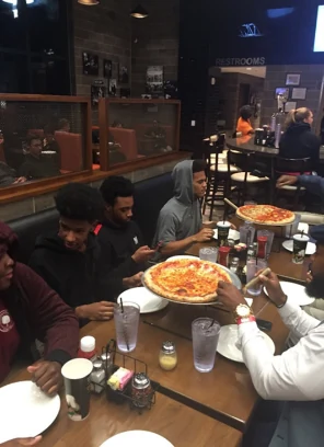 Students sharing a dinner reflection after the lecture