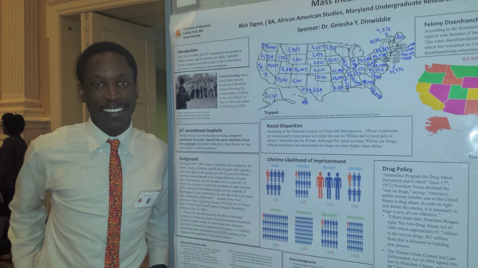 Rick Tamno beside his undergraduate mass incarceration research poster at Maryland Undergraduate Research Day