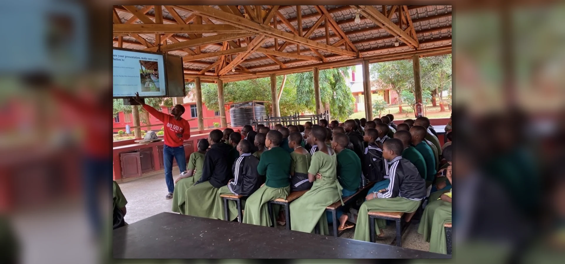 A literacy facilitator presenting to students during a school program