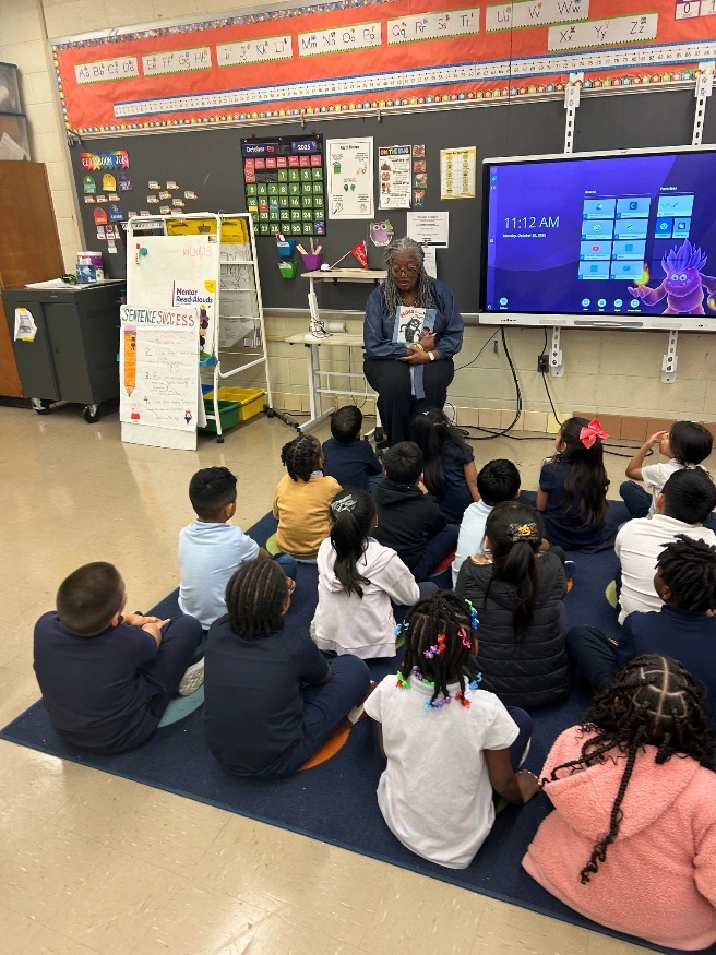 An author leading a classroom read-aloud visit